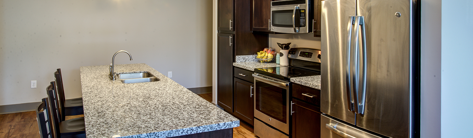 Apartment kitchen featuring bar seating
